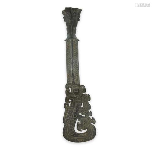 A Chinese bronze utensil, possibly shang-zhou dynasty