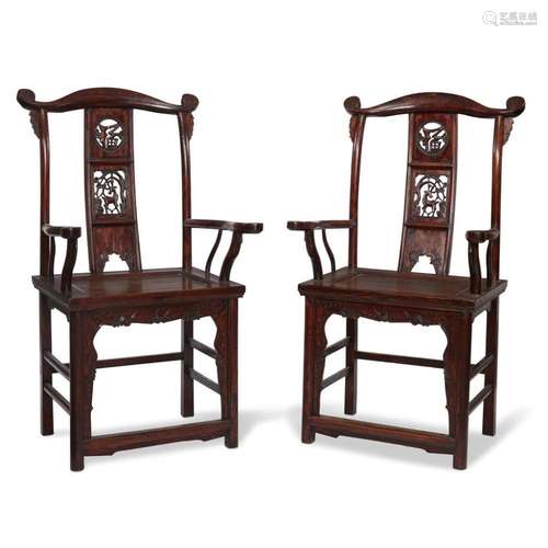 A pair of Chinese carved and lacquered wood yoke-backed arm chairs, 19th century