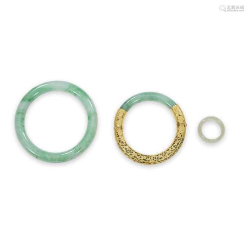 Two Chinese jadeite bracelets and a jadeite ring,