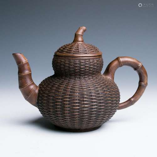 A ZISHA WICKER TEA POT