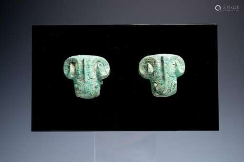 A PAIR OF ARCHAIC RAM MASK HANDLES, ZHOU DYNASTY