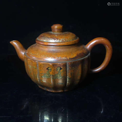 A PURPLE CLAY TEAPOT