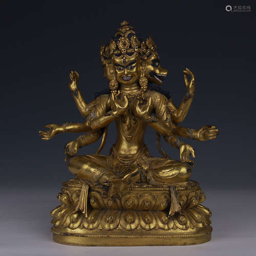 TIBETAN GILT BRONZE SEATED THREE FACE EIGHT ARM BUDDHA