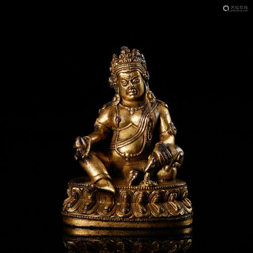 CHINESE GILT BRONZE FIGURE OF JAMBHALA