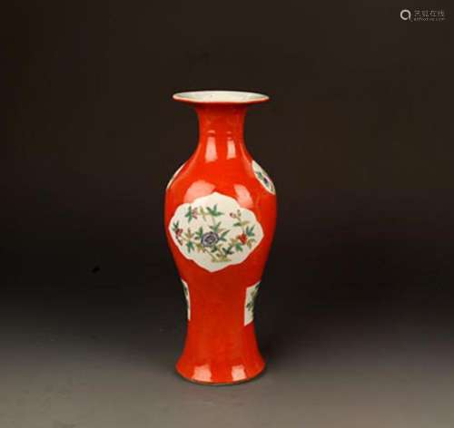 A CORAL RED GROUND FAMILLE ROSE GUAN YIN VASE
