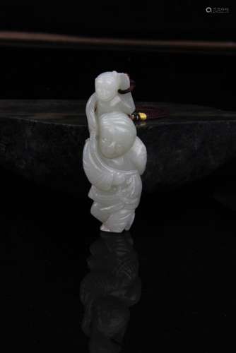 A FINE HE TIAN GREENISH WHITE JADE IN FIGURE OF MAN AND MONKEY