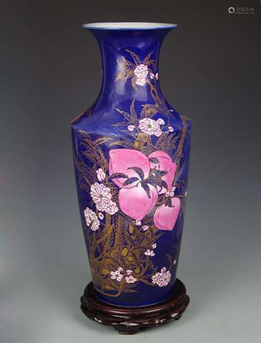 A BLUE GROUND GILT FLOWER PATTERN PORCELAIN VASE