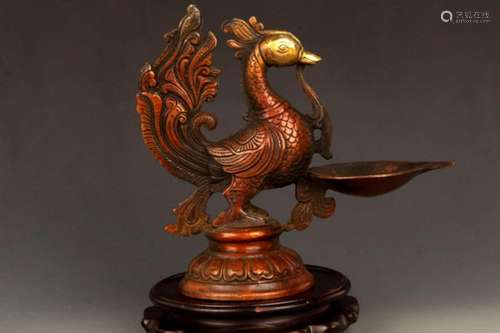 A BRONZE PHOENIX FIGURE CANDLESTICK