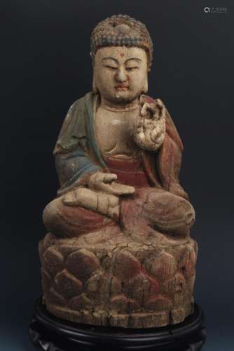 A WOOD COLORED AKSHOBHYA BUDDHA