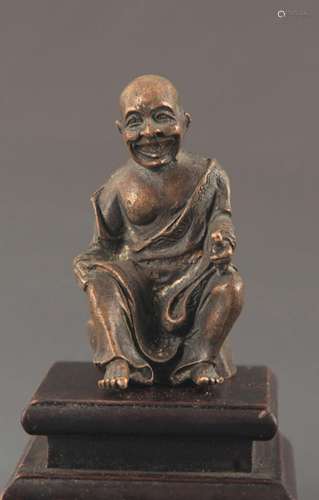 A BRONZE ARHATS STATUE