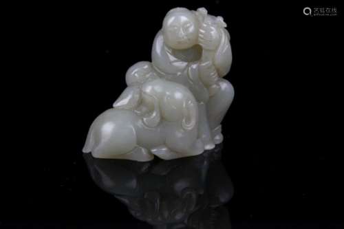 A FINE HE TIAN GREENISH WHITE JADE IN FIGURE OF BOY WITH LOTUS