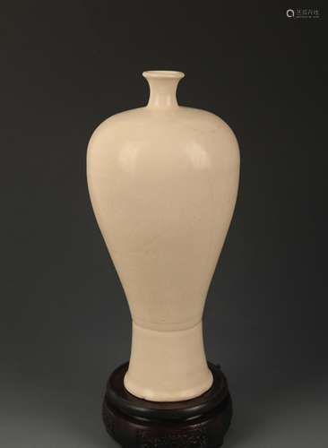 A DING KILN FINELY CARVED MEI STYLE VASE