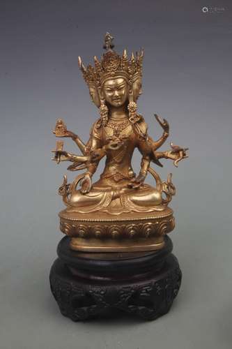 A RARE BRONZE AND GOLD GILT BULMO STATUE