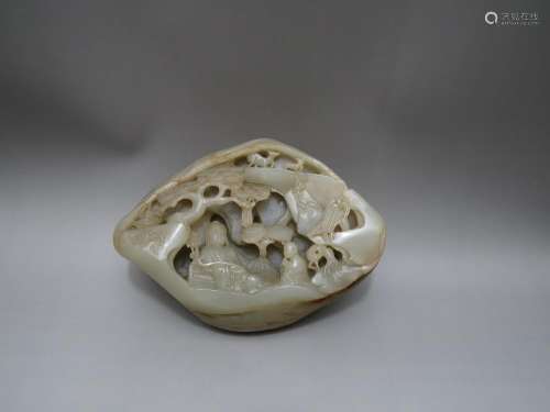 A PALE AND RUSSET JADE PEBBLE