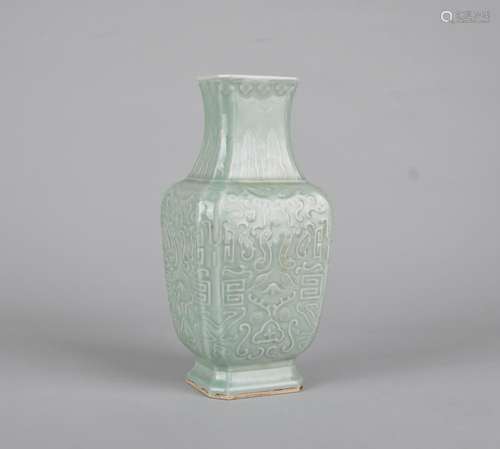 A MOLDED CELADON-GLAZED VASE, QIANLONG MARK, QING DYNASTY