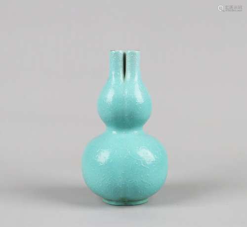 A TURQUOISE-GLAZED AND MOTIF-IN-RELIEF DECORATED DOUBLE-GOURD-SHAPED VASE, QIANLONG MARK, QING DYNASTY