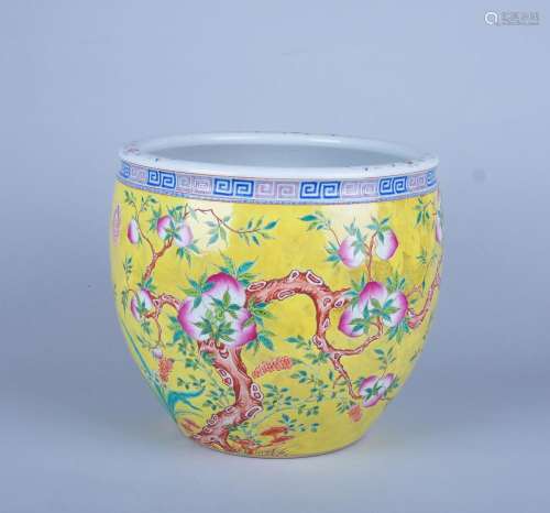 A LARGE YELLOW-GROUND FAMILLE ROSE BOWL, 'YONG QING CHANG CHUN' MARK, 19TH CENTURY