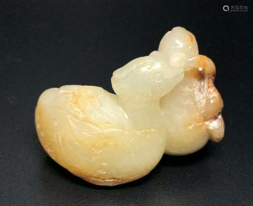 A WHITE AND RUSSET JADE ‘TWO MANDARIN WITH LOTUS PLANTS’ CARVING