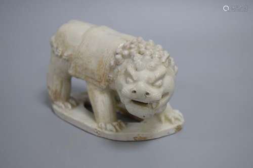 A WHITE-GLAZED LION, SONG DYNASTY OR EARLIER