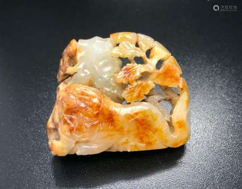 A WHITE AND RUSSET JADE 'TIGER ON MOUNTAIN' PENDANT