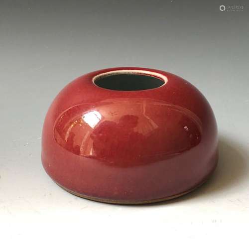 A RED GLAZED WASHER POT