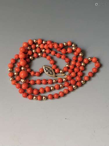 14K YELLOW GOLD CORAL NECKLACE.