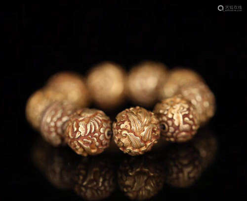 A GOLD BEADS STRING BRACELET