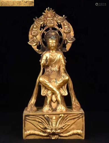 A GILT BRONZE MOLDED GUANYIN STATUE