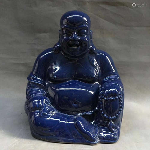 A BLUE GLAZE LAUGHING BUDDHA PORCELAIN STATUE