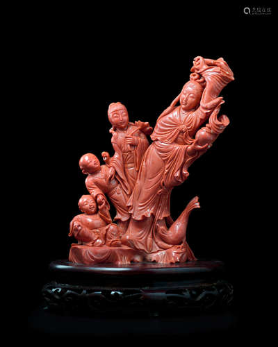 A CORAL 'MOTHER AND CHILDREN' FIGURAL GROUP