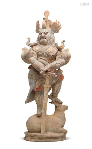 Tang dynasty A PAINTED POTTERY FIGURE OF A GUARDIAN