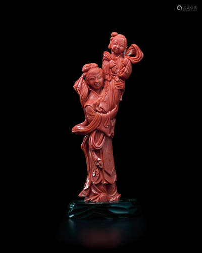 A CORAL 'MOTHER AND CHILD' FIGURAL GROUP