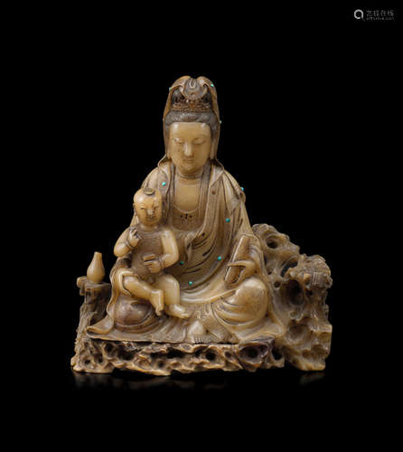 17th/18th century A SOAPSTONE FIGURE OF GUANYIN AND CHILD