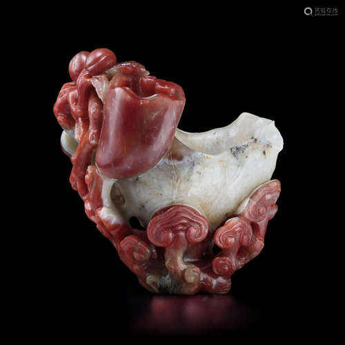 18th/19th century A CARNELIAN AGATE 'LOTUS AND LINGZHI' WASHER