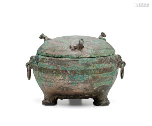Warring states period, 5th/4th century B.C.  AN ARCHAIC BRONZE RITUAL TRIPOD VESSEL AND COVER, DING