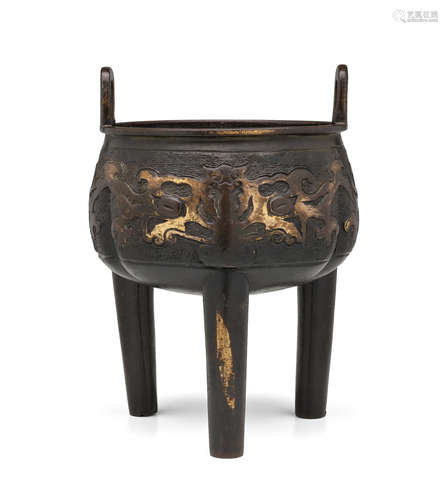 Ming dynasty A PARCEL GILT-BRONZE 'TAOTIE' TRIPOD CENSER