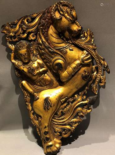 Gilt Bronze  Deity riding a horned  Beast