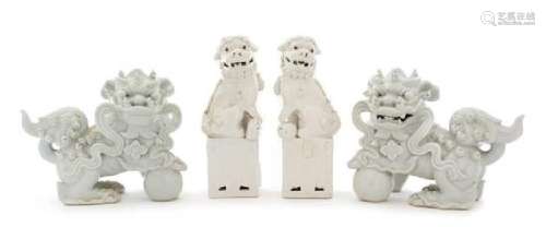 Two Pairs of Blanc-de-Chine Porcelain Figures of Fu