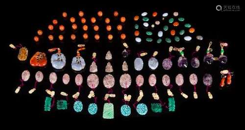 * A Large Collection of Ninety-Two Hardstone Pendants