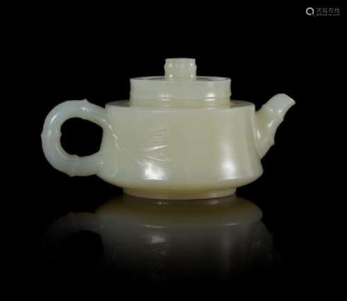 A Carved White Jade Teapot Width 3 7/8 inches.
