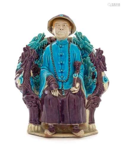 A Turquoise Aubergine Glazed Porcelain Figure of an