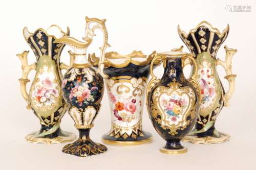 A pair of 19th Century twin handled posy vases each decorated with a spray of hand painted flowers against a blue and pale yellow ground