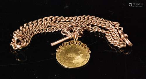 A 9ct rose gold graduated Albert chain with suspended George III 1789 guinea fob