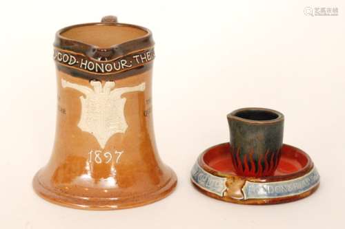 An early 20th Century Royal Doulton vesta ashtray modelled as a bucket sat within a pool of flames with Crucible Manufacturers