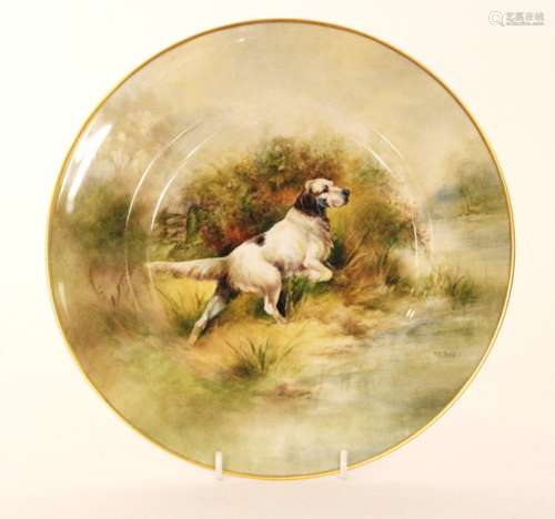 A later 20th Century cabinet plate decorated by former Royal Worcester artist Richard Budd with a hand painted dog amidst grasses