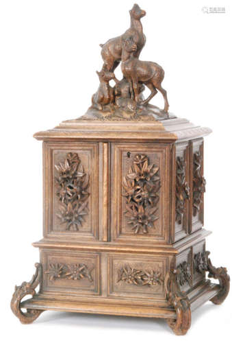 A 19th Century Black Forest carved walnut jewellery cabinet