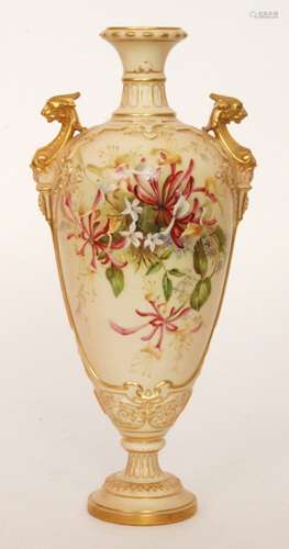 A large early 20th Century Royal Worcester shape 1764 twin handled vase decorated with hand painted sprays of honeysuckle and jasmine flowers against a blush ivory ground with gilt griffin head handles