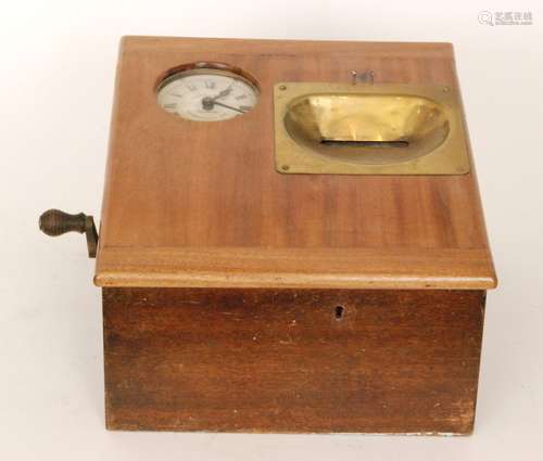 An early 20th Century mahogany table top clocking in machine by Gledhill Bros records Huddersfield