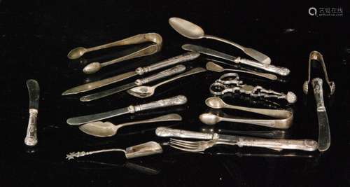 A quantity of hallmarked silver spoons and sundry flatware to include sugar nips etc