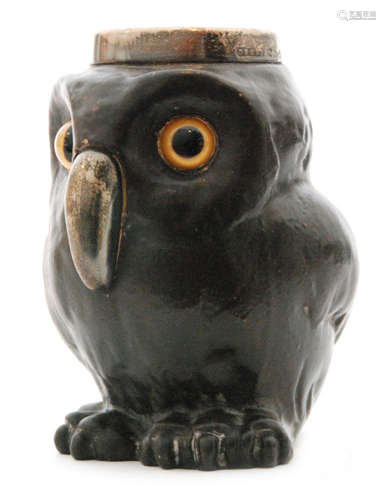 A late 19th Century Doulton Lambeth silver mounted vesta modelled as an owl glazed in brown with inset glass eyes and a hallmarked silver beak